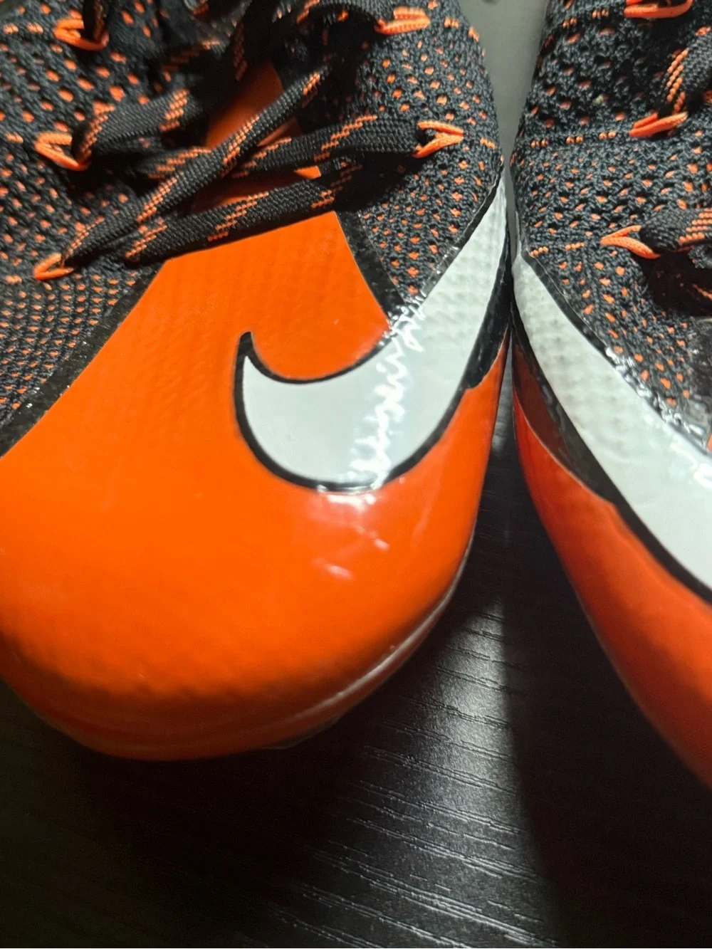 Nike Black and Orange Soccer Cleats with White Swoosh